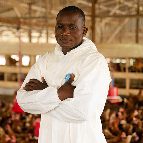 Farmer holding chick